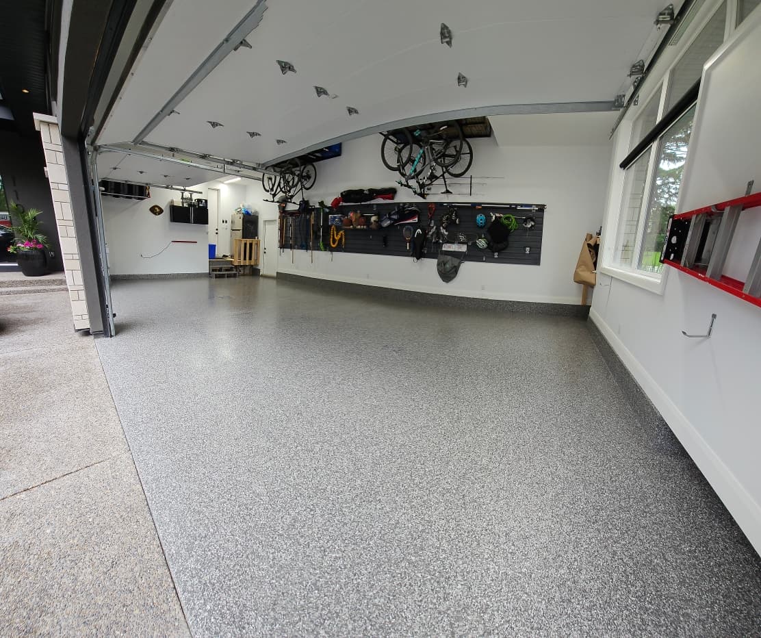 Finished polyaspartic flake garage floor installed by Sparta Tech Coatings